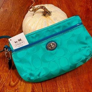 Coach beautiful green wristlet.